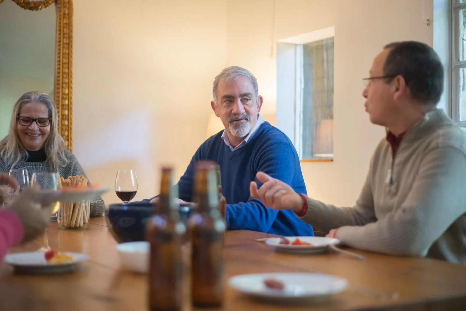 Older adults talking around a table.