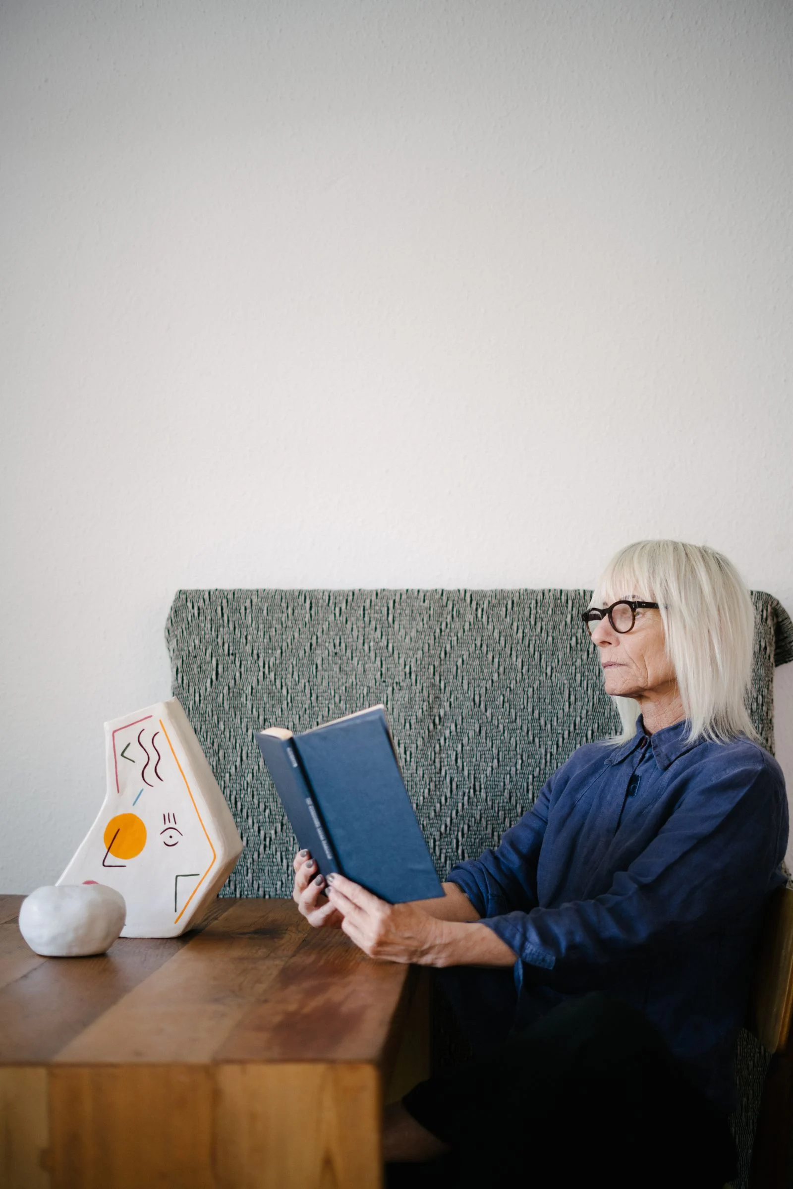 A woman taking quiet time to read at home.